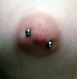 Deeply pierced nipple