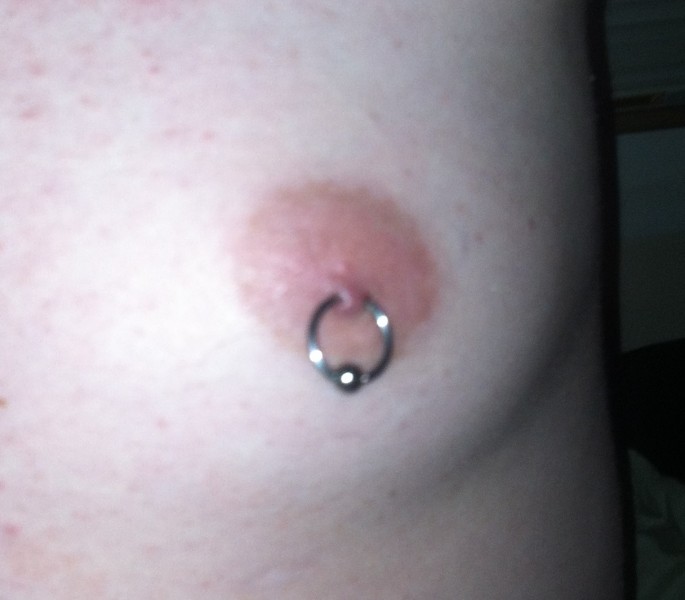 Shallow, rejecting male nipple piercing