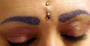 My bindi piercing (on my forehead), which was done in the mid 1990s