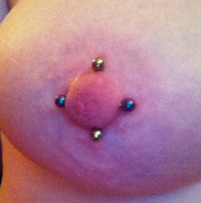 A multiple female nipple piercing-vertical and horizontal