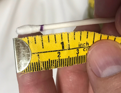 Swab next to a ruler 